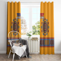Yellow dashiki window curtain pair with blue emblem and colorful geometric border