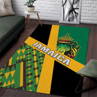 Green area rug with JAMAICA lettering, lion graphic, and Kente-style geometric pattern