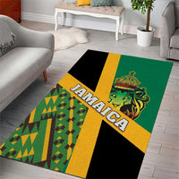 Green area rug with bold JAMAICA banner stripe and lion face over geometric Kente blocks