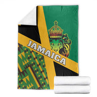 Jamaica lion Rastafarian blanket with Kente pattern, lion crest and stacked white towels