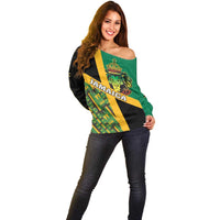 Green and black off-shoulder sweater with Jamaica Lion front graphic, long sleeves
