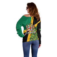 Green off-shoulder sweater with Jamaica crest on black back, dropped shoulders