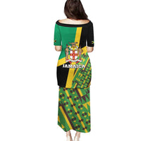 Green long dress, back view, Jamaica lion crest text with kente-style pattern, short sleeves