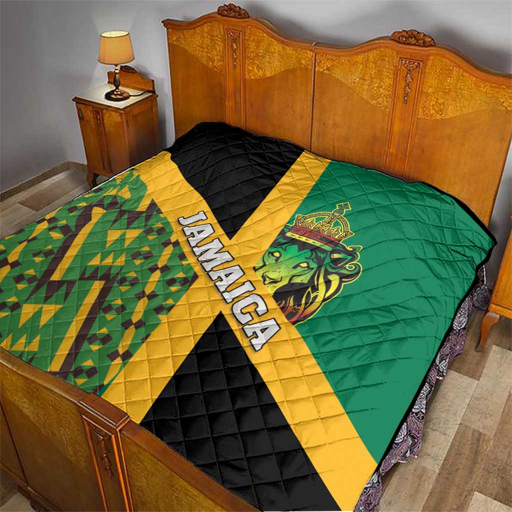 Green and black Jamaica lion quilt with yellow stripe and quilted chevron texture on bed