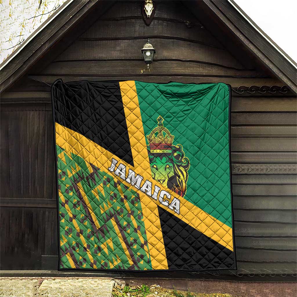 Green quilt with yellow and black panels, quilted design, Jamaica lettering, and lion crest