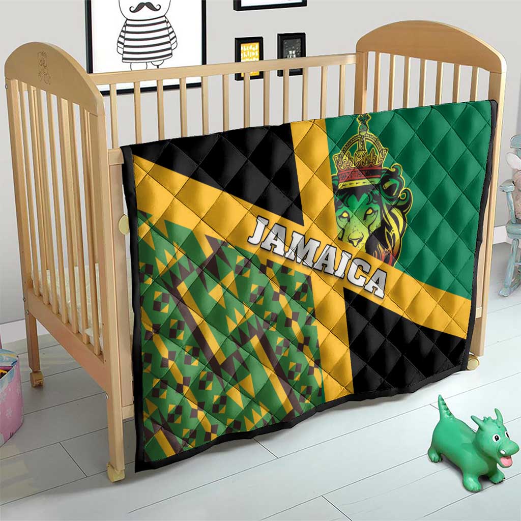 Green and black quilt for nursery with yellow stripe, Jamaica text, and lion crest