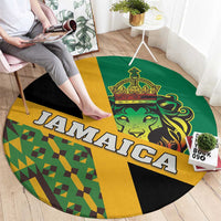 Round green carpet with bold Jamaica lettering, lion face crest, and kente geometric panel