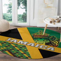 Round green carpet featuring Jamaica lettering, lion crown emblem, and kente diagonal blocks