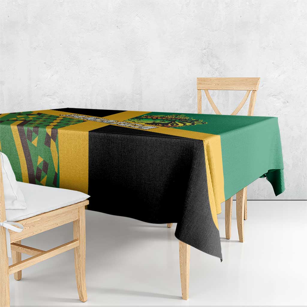 Green tablecloth with yellow border and black-and-yellow Kente geometric pattern