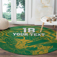 Round green rug with yellow cricket-leaf design and 'YOUR TEXT' banner