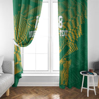 Green window curtains with gold cricket and floral design, draped over window sides.