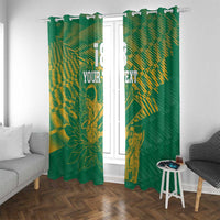 Green window curtains with gold cricket and floral print, shown with side seating in room.
