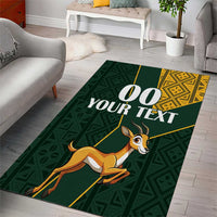 Green rug with springbok, yellow geometric border and '00 YOUR TEXT' custom print
