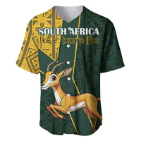 Green baseball jersey with yellow kente patterns and springbok graphic, front buttons.