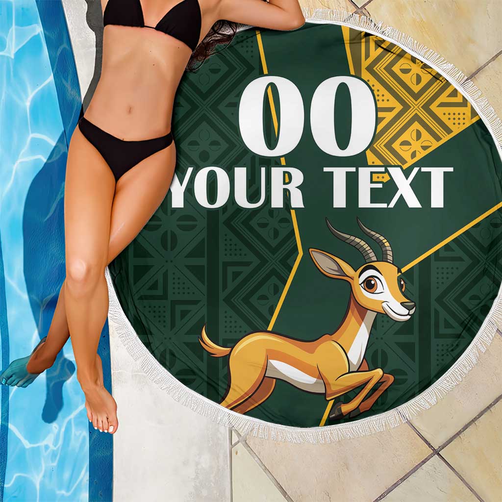 Round green beach blanket with fringe edge, springbok graphic and custom text overlay