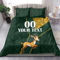 Green bedding set with yellow Kente diamond panel and springbok graphic with custom text