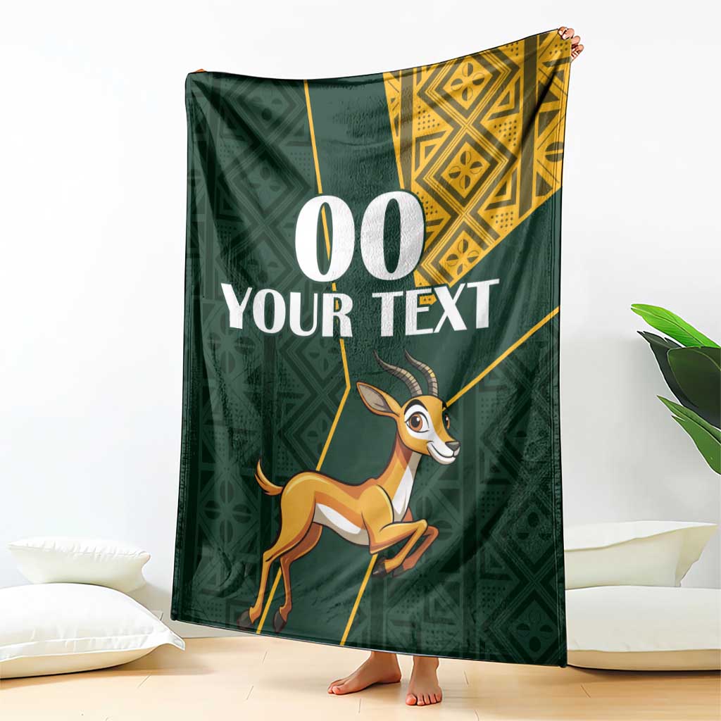 Green springbok jumping blanket with yellow Kente-style border and custom text