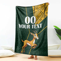 Green springbok jumping blanket with yellow Kente-style border and custom text