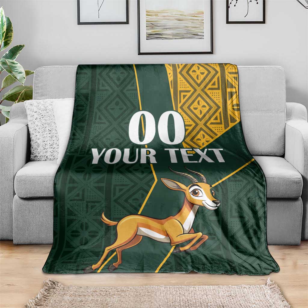 Green springbok themed blanket with yellow patterned corner and custom text