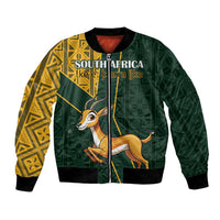 Unisex green bomber jacket, yellow Kente sleeves, springbok graphic, 'SOUTH AFRICA' front