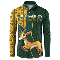 Dark green button sweatshirt with yellow Kente-style panels and front springbok graphic
