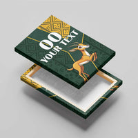 Canvas wall art top-down view with springbok, green geometric design, and kente-style panel, “00 YOUR TEXT”