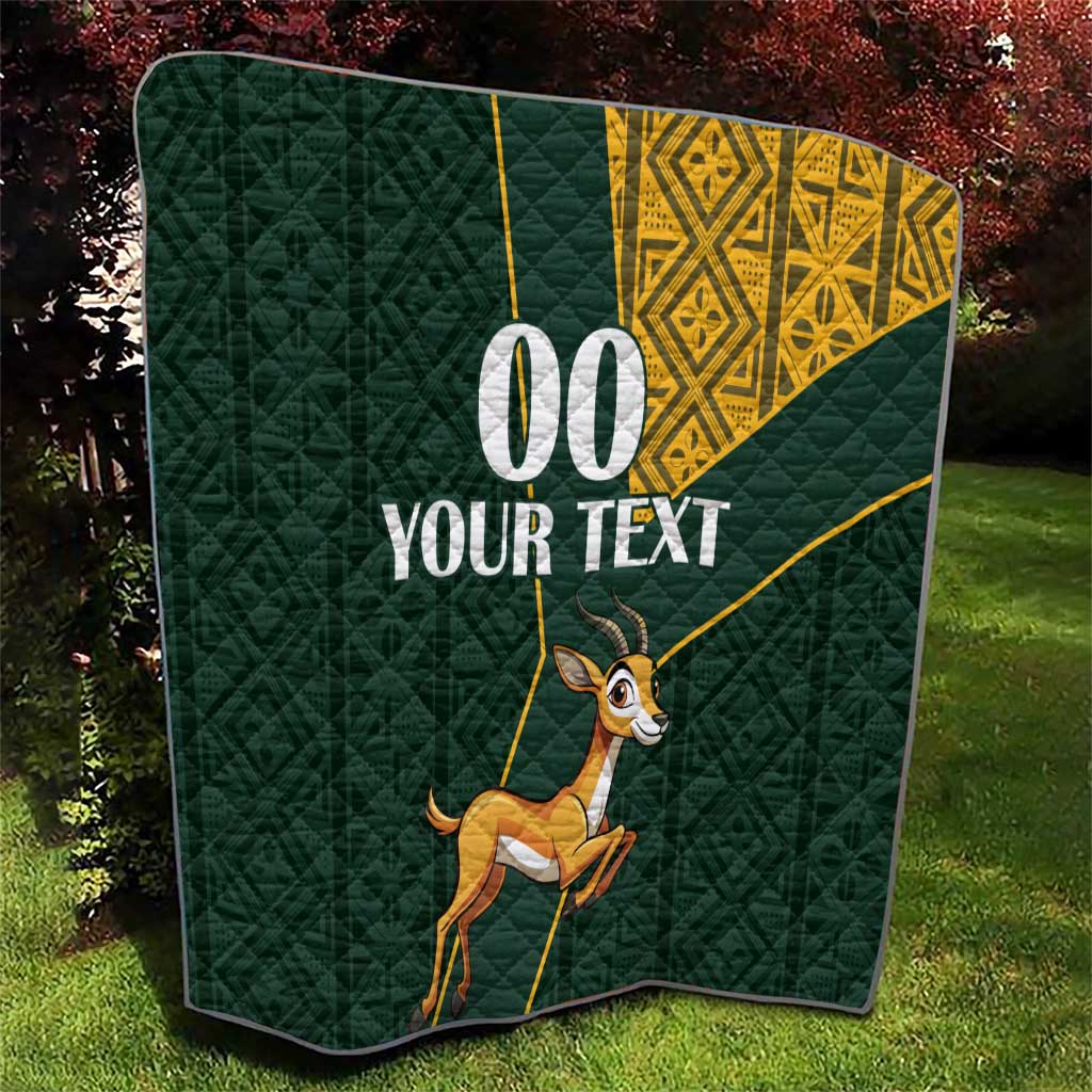 Dark green quilt with yellow Kente-style pattern, jumping springbok, custom “00 YOUR TEXT”