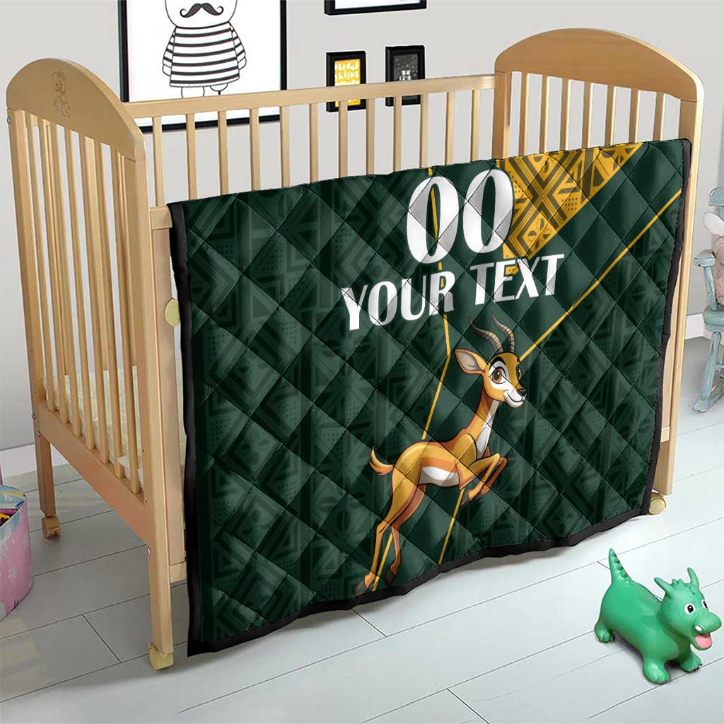 Dark green quilt for crib with yellow Kente-style corner, jumping springbok, “00 YOUR TEXT”
