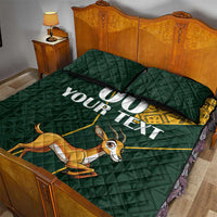 Green quilt bed set with jumping springbok graphic and yellow Kente-style border