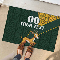 Green rubber doormat with large 00 YOUR TEXT and springbok graphic, yellow corner accents