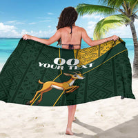 Green sarong with gold kente border and springbok print, back tie straps