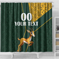 Green shower curtain with springbok graphic, gold Kente-style pattern strip and custom text 00 YOUR TEXT