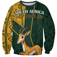 Unisex green sweatshirt with yellow geometric side panels, antelope graphic and 'SOUTH AFRICA' text