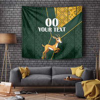 Green springbok tapestry with gold geometric kente pattern banner and custom text