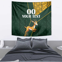 Green springbok tapestry wall decor with gold kente-style geometry and custom text