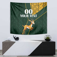 Green springbok tapestry featuring gold kente geometry and a centered custom text area
