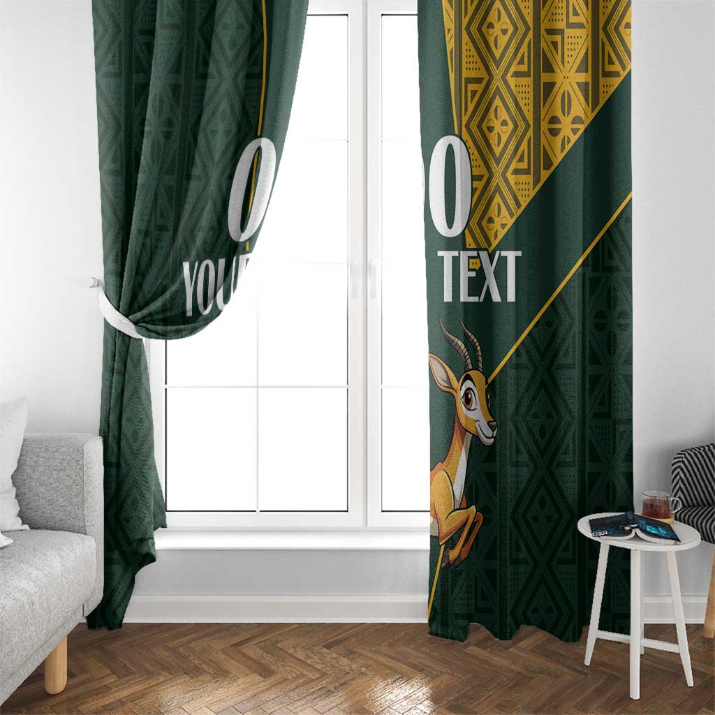 Green window curtains with springbok motif, yellow top panel, and bold white text
