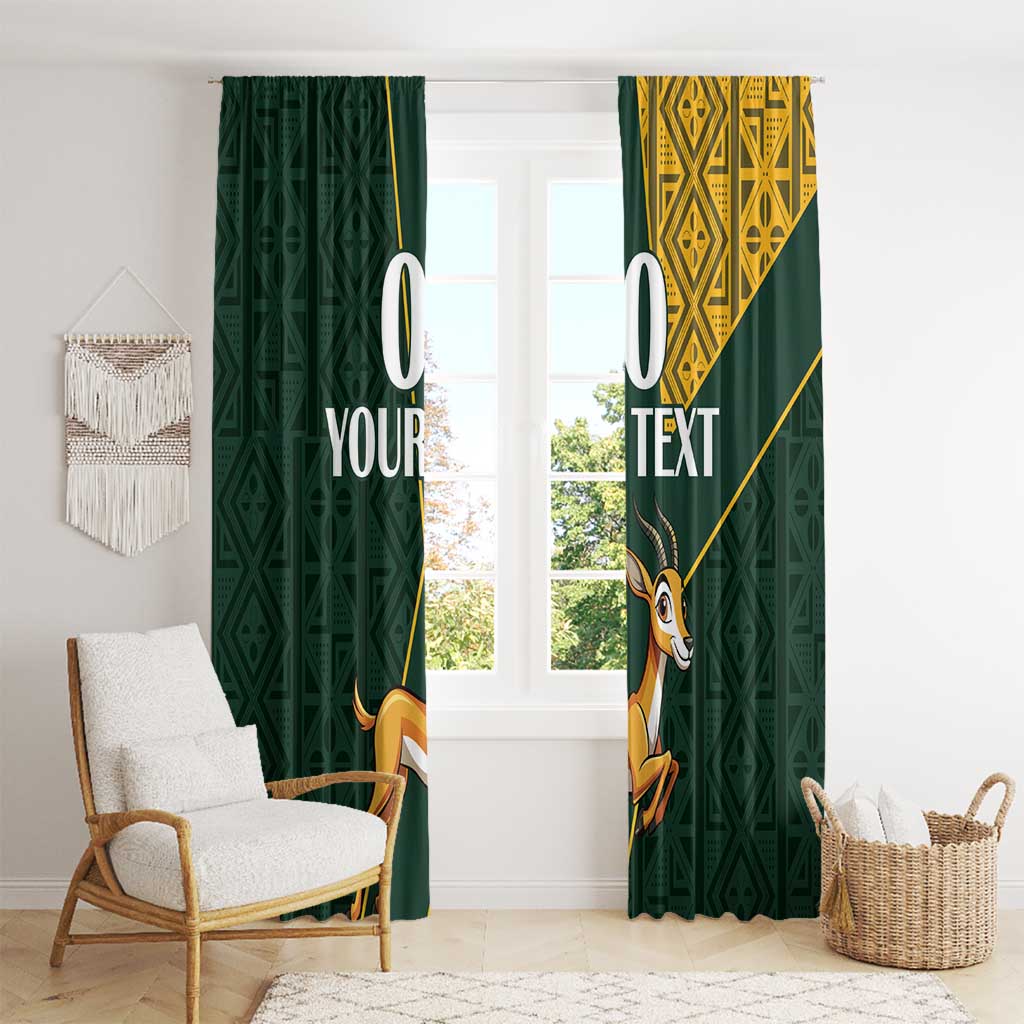 Green window curtains with springbok graphics and yellow geometric Kente-style accents