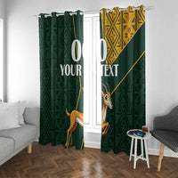 Green window curtains with springbok design, yellow geometric panel, and hanging rings