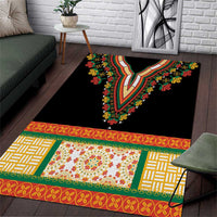 Black area rug with colorful V-shaped embroidered motif and floral border