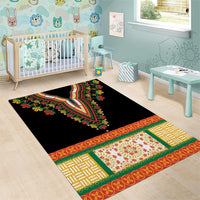 Black area rug with bright embroidered floral medallion and geometric border