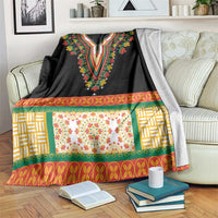 Black dashiki blanket with embroidered V neckline, floral center panel, and woven borders