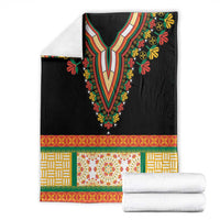 Black dashiki-style blanket with embroidered V neckline and colorful floral border