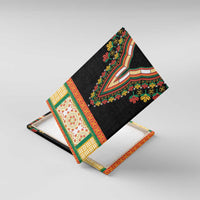 Black dashiki canvas wall art shown at an angle with embroidered floral V-neckline