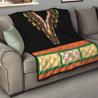 Black quilt blanket with embroidered V-neck floral neckline and multicolor geometric border strip