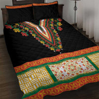 Black quilt bed set with central V embroidery, orange border, and two pillows