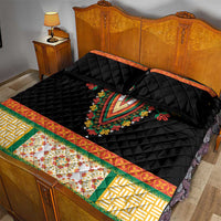 Black quilt bed set with colorful floral V embroidery, orange piping, and green and yellow border