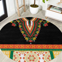 Black round embroidered rug with colorful floral V motif and patterned border