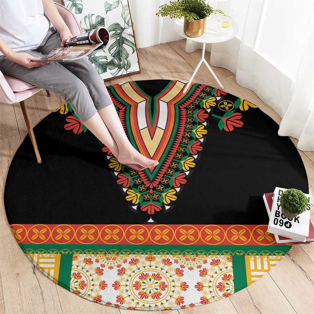 Black round rug with central V-shaped floral embroidery and multicolor patterned edge