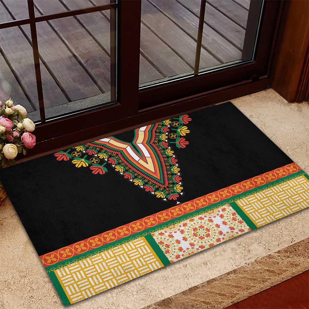 Black rubber doormat with bold V-shaped neckline embroidery and patterned green-red border